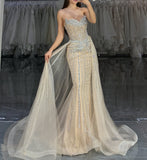 STRAPLESS CRYSTAL EMBELLISHED GOWN WITH OVERSKIRT